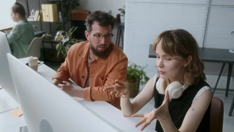 Two Programmers Discussing New App Stock Footage 313491527