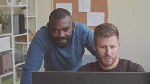 Two Programmers Discussing Software on Computer in Office Stock-Footage 224048643