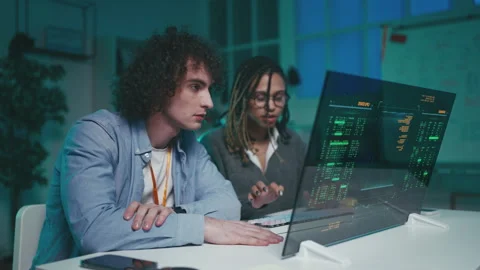 Two programmers launch new software on futuristic computer and share a high five Video stock 333195141