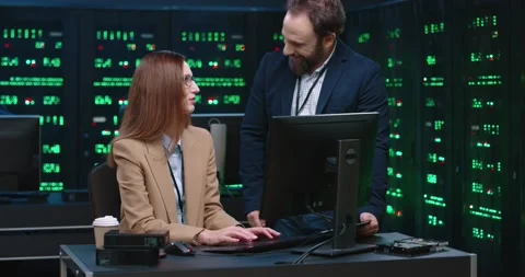 Two programmers: man and woman communicate in office on work issues. System Stock Footage 145295732