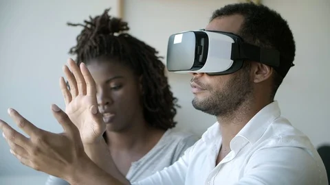 Two programmers setting VR headset Stock Footage 117365758