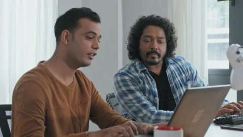 Two Programmers Talking while Working on Computers Stock Footage 203733625