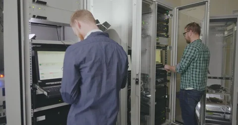 Two programmers work in data center Stock Footage 107384125