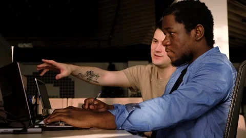 Two programmers working in the office of a software development company. Coding Video stock 234236071