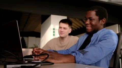 Two programmers working in the office of a software development company. Coding Video stock 234463699