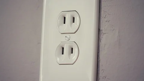 Two Prong Outlet Tilt Up on Plaster Wall in Old Home Stock Footage 112886194
