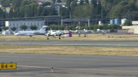 Two propeller plane taking off Stock Footage 2337445