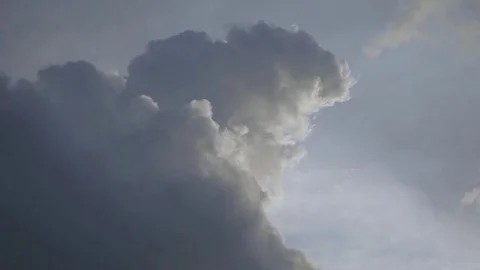 Two Puffy Clouds Passing By in Real Time Stock Footage 73822487