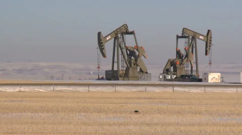 Two pumpjacks pumping crude oil Stock Footage 44614680