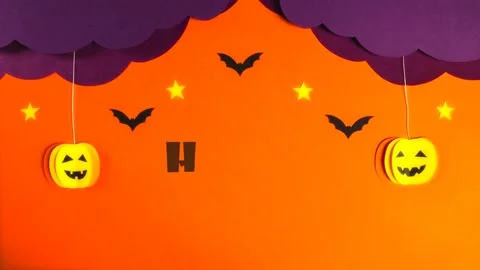 Two pumpkins fall out of curly lilac clouds. Stars light up, black bats fly Video stock 158453555