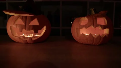 Two pumpkins glow on Halloween night. Stock Footage 212004395