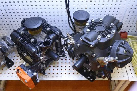 Two pumps placed on a stand during an exhibition Stock Photos