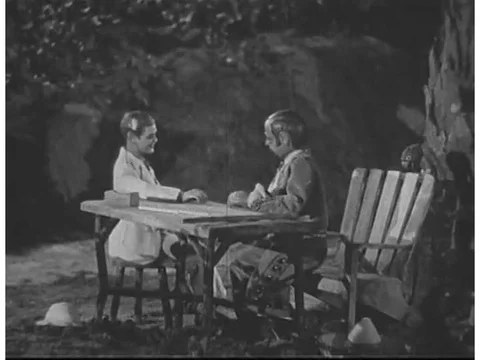 Two puppets sit around a table talking about the significance of coffee houses Stock Footage 74935690