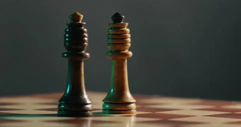 Two Queen figures spread on the chess board 4K video Stock Footage 131135389