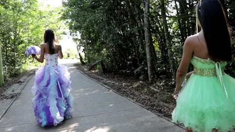Two Quinceanera Sisters- Walking Through a Forest Path Stock Footage 243236826