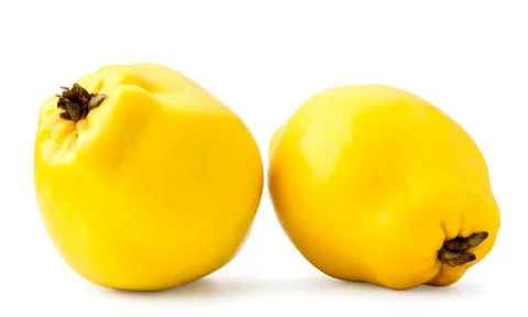 Two quinces close-up on a white. Isolated Stock Photos