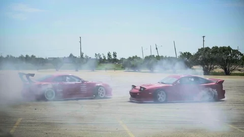 Two Race Cars Drifting at Car Show Stock Footage