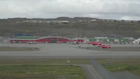 Two RAF Red Arrows Jets Formation Takeoff, Wide Shot at Iqaluit Airport Stock Footage 343436606