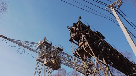 Two railway cranes are standing on rails against the background of the sky Stock Footage 213727465