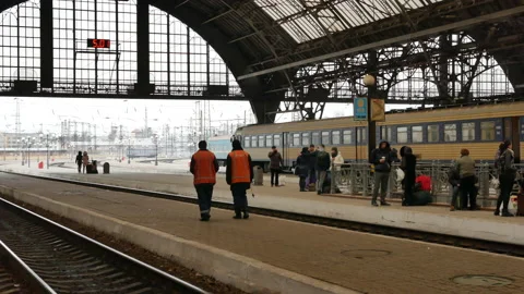 Two railway workers in uniform on the platform of Lviv train station, Ukraine - Stock Footage 178480739