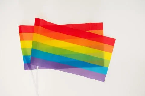 Two rainbow flags on white background Stock Photos