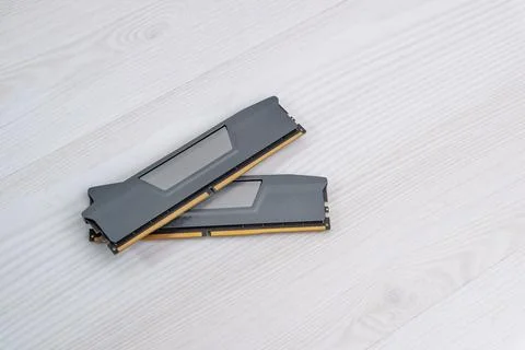 Two RAM memory modules placed on light wooden desk, computer hardware compo.. 写真素材