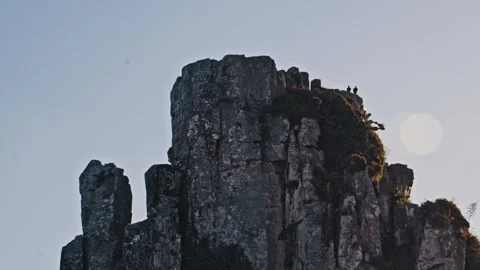 Two Ravens Perched on a Rocky Mountain Peak at Sunset 스톡 동영상 342331678
