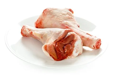 Two raw uncooked lamb shanks Stock Photos
