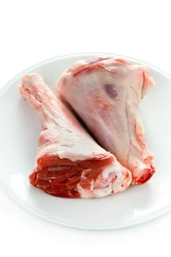 Two raw uncooked lamb shanks Stock Photos