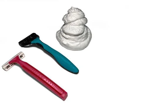 Two razors lie on a white background. Stock Photos