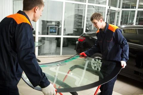 Two Real Mechanics working in Auto Repair Shop Stock Photos