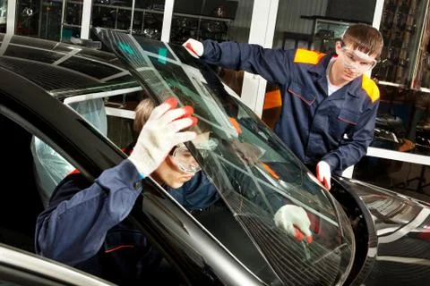 Two Real Mechanics working in Auto Repair Shop Stock Photos