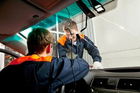 Two Real Mechanics working in Auto Repair Shop Stock Photos