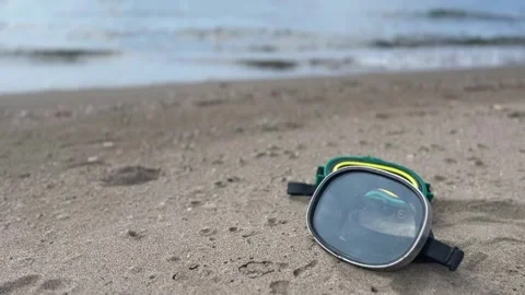 Two recreational diving masks lying on beach sand in summer Stock Footage 292950009