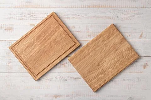 Two rectangular cutting boards with edging on a white wooden table. mockup of 스톡 사진