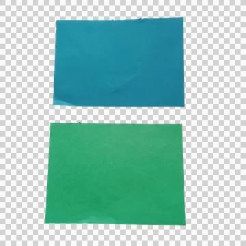 Two rectangular pieces of blue and green paper on a flat surface Stock Photos