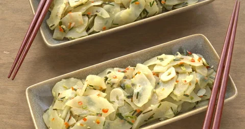 Two rectangular plates with stir-fried Indian yellow cucumber. Stock Footage 281486033