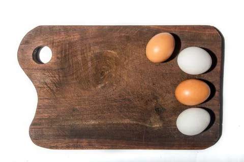Two red and two white eggs Stock Photos