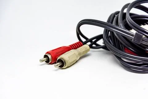 Two red and white audio RCA plugs isolated on a white background. Stock Photos