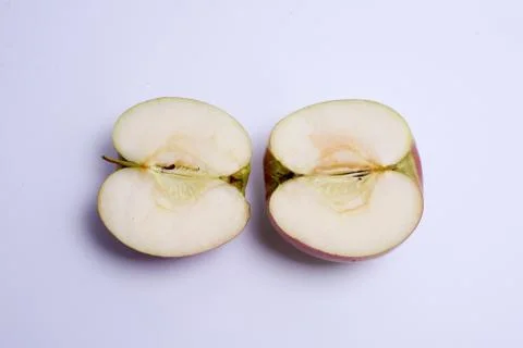 Two red apple halves isolated on the white background Stock Photos
