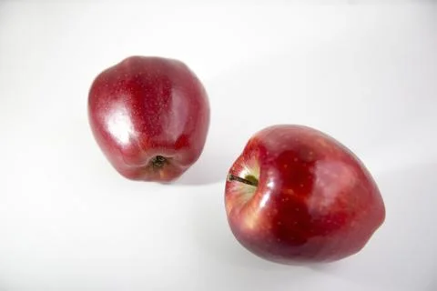 Two red apples isolated on white background with clipping path and shiny refl 库存照片
