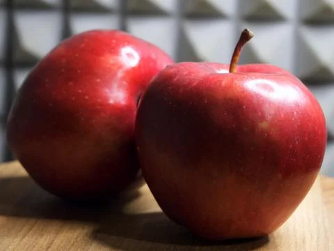 Two red apples of the red chief variety, a close-up shot. Stock Photos