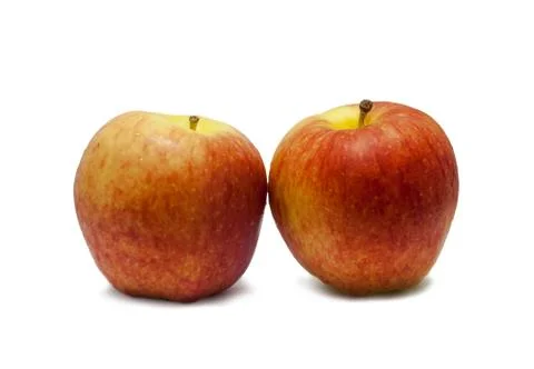 Two red apples on a white background. Stock Photos