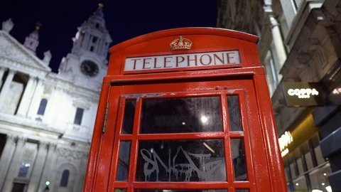 Two Red British Telephone Booth at Night in Central London, UK Stock Footage 112187072
