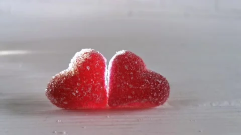 Two red candy heart, white background with light, concept of love Valentines Day Stock Footage 227341096
