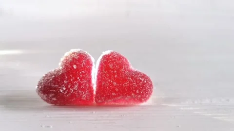 Two red candy heart, white background with light, concept of love Valentines Day Stock Footage 227341098