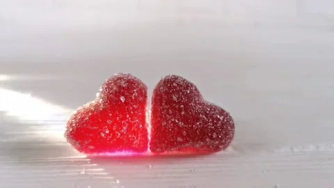 Two red candy heart, white background with light, concept of love Valentines Day Stock Footage 227341128