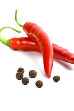 Two red cayenne and aromatic pepper Stock Photos