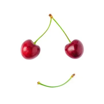 Two red cherries on a white background. Smile concept. Don't worry Be Happy. Stock Photos