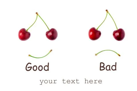 Two red cherries on a white background. The concept of joy and sorrow. Stock Photos